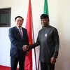 Trong ảnh: Phó Tổng thống Nigeria Yeni Osinbajo và Phó Thủ tướng Vương Đình Huệ. (Ảnh: Phi Hùng/TTXVN)