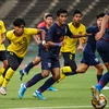 U19 Malaysia (áo vàng) đánh bại Thái Lan để giành vé dự vòng chung kết. (Nguồn: AFC)