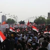 Người dân Iraq tuần hành tại thủ đô Baghdad. (Ảnh: THX/TTXVN)