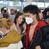 Hành khách đeo khẩu trang để phòng tránh lây nhiễm COVID-19 tại sân bay Sydney, Australia. (Ảnh: AFP/TTXVN)