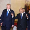 Thủ tướng Nguyễn Xuân Phúc hội kiến Tổng thống Hoa Kỳ Donald Trump nhân dịp sang Việt Nam dự Hội nghị thượng đỉnh Hoa Kỳ-Triều Tiên lần thứ hai. (Ảnh: Thống Nhất/TTXVN)