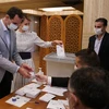 Tổng thống Bashar al-Assad đi bỏ phiếu. (Nguồn: AP)