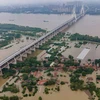 Cảnh tượng ngập lụt do mưa lớn tại Vũ Hán, Trung Quốc ngày 13/7. (Ảnh: AFP/TTXVN)