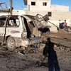 Hiện trường vụ đánh bom xe ở thành phố Azaz, Syria ngày 19/7. (Ảnh: AA/TTXVN)