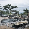 Nhà cửa bị thiêu rụi trong một vụ tấn công tại làng Manzalaho, gần Beni, CHDC Congo, ngày 18/2. (Ảnh: AFP/ TTXVN)