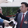 Đồng chí Đỗ Trọng Hưng (Đoàn đại biểu Đảng bộ tỉnh Thanh Hoá) trả lời phỏng vấn của phóng viên các cơ quan thông tấn, báo chí. (Ảnh: TTXVN)