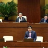 Bộ trưởng Bộ Kế hoạch và Đầu tư Nguyễn Chí Dũng phát biểu giải trình, làm rõ một số vấn đề đại biểu Quốc hội nêu. (Ảnh: Phạm Kiên/TTXVN)