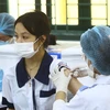 Học sinh tại trường THPT Ngô Quyền thành phố Hải Phòng được tiêm vaccine phòng, chống COVID-19. (Ảnh: An Đăng/TTXVN)