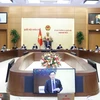 [Photo] Bế mạc Phiên họp thứ 8 của Ủy ban Thường vụ Quốc hội