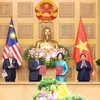 Hình ảnh Lễ trao đổi các văn kiện hợp tác Việt Nam-Malaysia