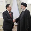 Chủ tịch Quốc hội Vương Đình Huệ hội kiến Tổng thống Iran