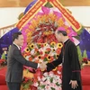 Phó Thủ tướng Trần Lưu Quang thăm, chúc mừng Giáng sinh 2023 tại Tòa Giám mục Xuân Lộc, thành phố Long Khánh, tỉnh Đồng Nai. (Ảnh: Lê Xuân/TTXVN)