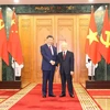 Tổng Bí thư Nguyễn Phú Trọng và Tổng Bí thư, Chủ tịch nước Trung Quốc Tập Cận Bình chụp ảnh chung. (Ảnh: Trí Dũng/TTXVN)