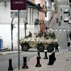 Lực lượng an ninh Ecuador tuần tra trên quảng trường và dinh Tổng thống ở Quito. (Ảnh: AFP/TTXVN)