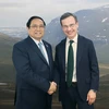 Thủ tướng Phạm Minh Chính gặp Thủ tướng Thụy Điển Ulf Kristersson bên lề Hội nghị COP28. (Ảnh: Dương Giang/TTXVN)