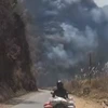 Cháy khu rừng lau lách tại huyện Thuận Châu, Sơn La. (Ảnh: TTXVN phát)
