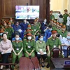 Bị cáo Trương Mỹ Lan cùng các đồng phạm tại phiên tòa ngày 12/3. (Ảnh: Thanh Vũ/TTXVN)