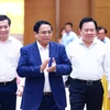 Thủ tướng Phạm Minh Chính đến Hội nghị Thủ tướng Chính phủ làm việc với doanh nghiệp nhà nước. (Ảnh: Dương Giang/TTXVN)
