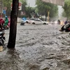 Đường Lưu Văn Lang (quận 1) ngập sâu trong mưa, chiều 14/6. (Ảnh: Hồng Giang/TTXVN)