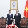 Phó Thủ tướng Trần Lưu Quang tiếp Phó Chủ nhiệm Ủy ban Dân tộc Nhà nước Cộng hòa dân chủ Nhân dân Trung Hoa Biên Ba Trát Xi. (Ảnh: An Đăng/TTXVN)