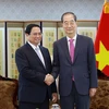 Thủ tướng Phạm Minh Chính hội đàm với Thủ tướng Hàn Quốc Han Duck Soo. (Ảnh: Dương Giang/TTXVN)