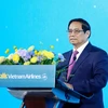Thủ tướng Phạm Minh Chính phát biểu tại Lễ kỷ niệm 30 năm Vietnam Airlines mở đường bay thẳng tới Hàn Quốc. (Ảnh: Dương Giang/TTXVN)
