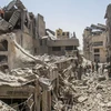 Những tòa nhà bị phá hủy sau các cuộc không kích của Israel xuống thành phố Gaza ngày 4/7/2024. (Ảnh: THX/TTXVN)