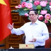Thủ tướng Phạm Minh Chính chủ trì họp về tình hình thi công Dự án đường dây 500kV mạch 3. (Ảnh: Dương Giang/TTXVN)
