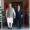 Thủ tướng Phạm Minh Chính​ gặp hẹp Thủ tướng Ấn Độ Narendra Modi. (Ảnh: Dương Giang/TTXVN)