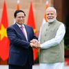 Thủ tướng Phạm Minh Chính​ và Thủ tướng Ấn Độ Narendra Modi. (Ảnh: Dương Giang/TTXVN)