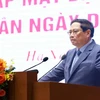 Thủ tướng Phạm Minh Chính phát biểu tại buổi gặp mặt đại diện doanh nghiệp nhân Ngày Doanh nhân Việt Nam (13/10). (Ảnh: Dương Giang/TTXVN)