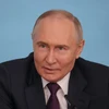 Tổng thống Nga Vladimir Putin phát biểu trong cuộc gặp đại diện các cơ quan truyền thông quốc tế. (Ảnh: AA/TTXVN)