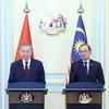 Tổng Bí thư Tô Lâm với Thủ tướng Malaysia Anwar Ibrahim tại buổi họp báo. (Ảnh: Thống Nhất/TTXVN)