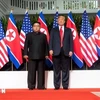 Ông Donald Trump (phải) trong cuộc gặp nhà lãnh đạo Triều Tiên Kim Jong-un tại Singapore ngày 12/6/2018. (Nguồn: AFP/TTXVN)