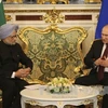 Tổng thống Nga Vladimir Putin (phải) và Thủ tướng Ấn Độ Manmohan Singh. (Nguồn: AFP/TTXVN)