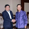 Phó Thủ tướng Lào Somsavath Lengsavath (phải) tiếp Thứ trưởng Nguyễn Chí Dũng. (Nguồn: Phạm Kiên/Vietnam+)