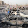Hiện trường vụ đánh bom xe tại một khu chợ đông đúc ở quận Sadr, thủ đô Baghdad. (Nguồn: AFP/TTXVN)