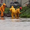 Cảnh ngập lụt sau những trận mưa lớn do ảnh hưởng của bão Mujigae tại Hải khẩu, tỉnh Hải Nam ngày 4/10. (Nguồn: THX/TTXVN) 