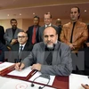 Đại diện 24 thành phố của Libya ký thỏa thuận thành lập Chính phủ đoàn kết dân tộc. (Nguồn: AFP/TTXVN)