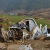Cảnh sát Nepal điều tra tại hiện trường vụ tai nạn máy bay của hãng hàng không Air Kasthamandap ngày 26/2. (Nguồn: THX/TTXVN) 