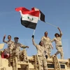 Lực lượng Chính phủ Iraq mừng chiến thắng sau chiến dịch giành lại thị trấn Zankura, thủ phủ tỉnh Anbar từ IS ngày 10/3. (Nguồn: AFP/TTXVN)
