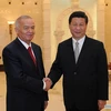 Chủ tịch Trung Quốc Tập Cận Bình và Tổng thống Uzbekistan Islam Karimov. (Nguồn: News.cn)