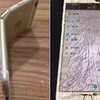 Một chiếc iPhone bị đập nát và bẻ cong. (Nguồn: oc.cc)