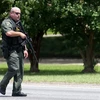 Cảnh sát Mỹ làm nhiệm vụ tại hiện trường vụ nổ súng. (Nguồn: AFP/TTXVN)