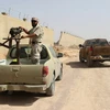 Binh sỹ ủng hộ Chính phủ Libya làm nhiệm vụ trong chiến dịch chống IS ở Sirte ngày 2/7. (Nguồn: AFP/TTXVN)