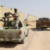 Binh sỹ ủng hộ Chính phủ Libya làm nhiệm vụ trong chiến dịch chống IS ở Sirte ngày 2/7. (Nguồn: AFP/TTXVN)