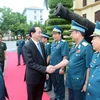 Chủ tịch nước Trần Đại Quang với cán bộ, chiến sĩ Quân chủng Phòng không-Không quân. (Ảnh: Nhan Sáng/TTXVN)