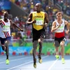 Usain Bolt (giữa) thi đấu ở nội dung chạy 200m nam. (Nguồn: EPA/TTXVN)