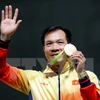 Đại tá Hoàng Xuân Vinh, vận động viên giành Huy chương Vàng đầu tiên của thể thao Việt Nam trên đấu trường Olympic. (Nguồn: TTXVN) 