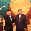 Tổng Bí thư, Chủ tịch nước Lào Bounnhang Volachith (phải) và Bộ trưởng Bộ Kế hoạch và Đầu tư Việt Nam Nguyễn Trí Dũng. (Ảnh: Phạm Kiên/Vietnam+) 